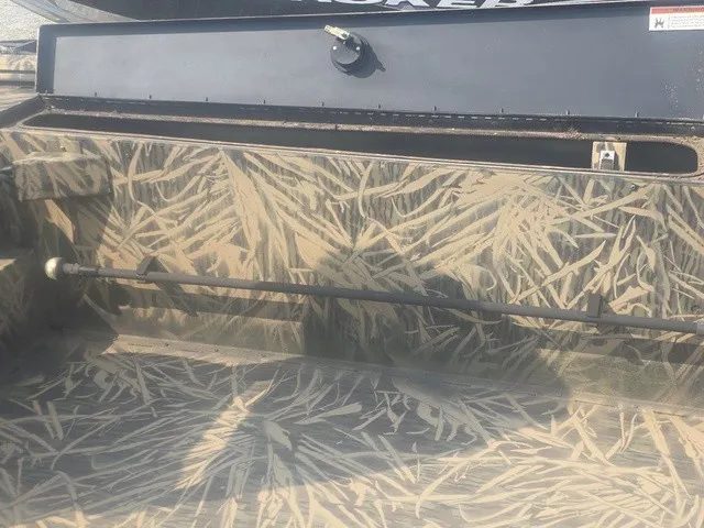 Slide: The Image of The image shows the interior of a boat with a camouflage pattern design. - 22