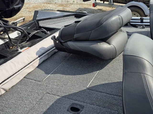 Slide: The Image of The image shows the interior of a 2020 Tracker Pro Team 175 TXW with gray seats. - 25