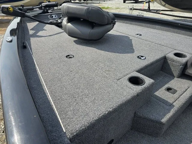 Slide: The Image of The image shows the gray deck of a 2020 Tracker Pro Team 175 TXW boat with a seat. - 16
