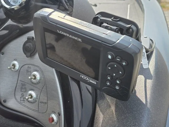 Slide: The Image of A Lowrance GPS device is mounted on the console of a Tracker Pro Team 175 TXW boat. - 27