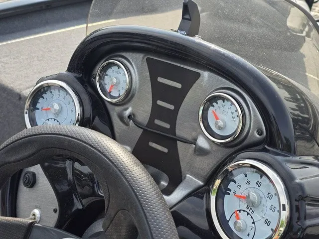 Slide: The Image of The dashboard of a 2020 Tracker Pro Team 175 TXW with multiple gauges and a steering wheel. - 29