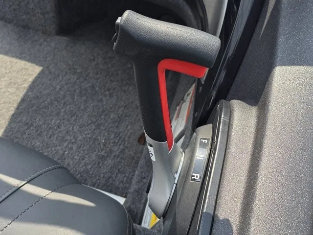 Slide: The Image of Close-up of a boat throttle lever with a black and red handle. - 30