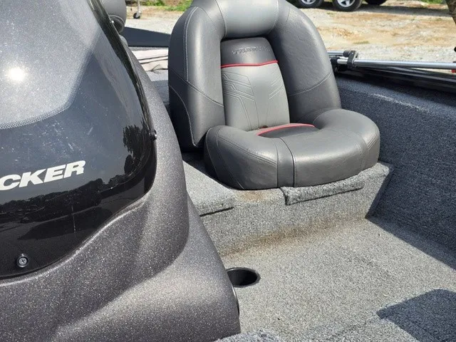 Slide: The Image of A gray seat in a 2020 Tracker Pro Team 175 TXW boat, featuring a cushioned seating area. - 23