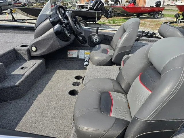 Slide: The Image of The image shows the interior of a 2020 Tracker Pro Team 175 TXW with gray seats and a helm. - 14