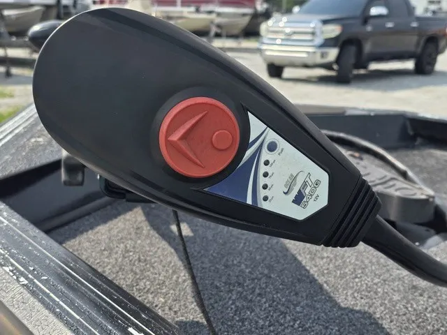 Slide: The Image of Close-up of a control device on a boat, featuring a red button and arrow symbol. - 19