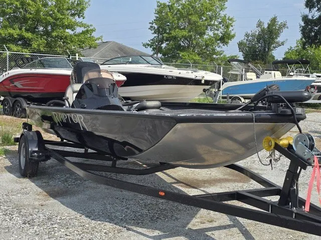 Slide: The Image of A 2020 Caravelle RAPTOR boat on a trailer in a parking area. - 3