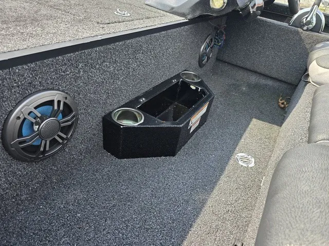 Slide: The Image of The image shows the interior of a 2020 Caravelle RAPTOR boat with speakers and cup holders. - 16