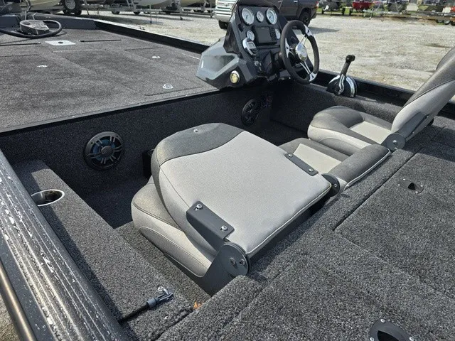 Slide: The Image of The image shows the cockpit of a 2020 Caravelle RAPTOR boat with gray seats and steering. - 15