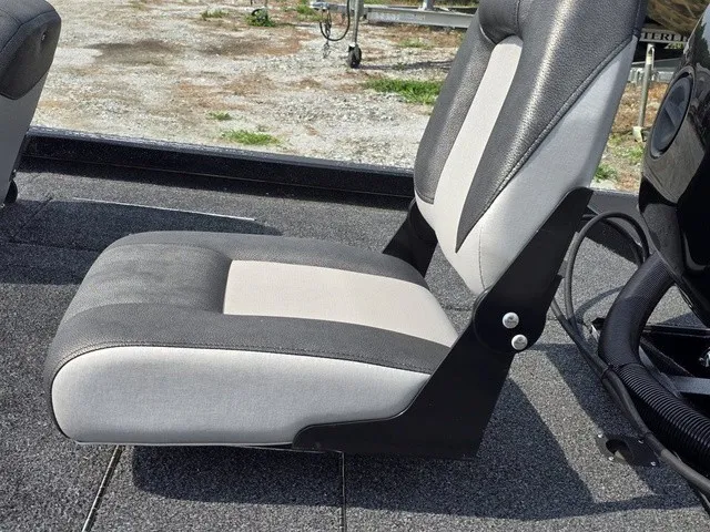 Slide: The Image of A gray and black boat seat with padded design on a 2020 Caravelle RAPTOR. - 13