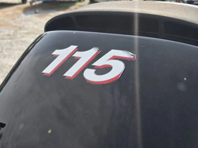 Slide: The Image of Close-up of a boat engine with the number 115. - 8