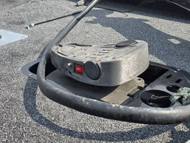 Slide: The Image of A control unit on a boat with gray carpet flooring and cables. - 23