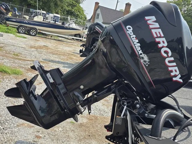 Slide: The Image of A Mercury OptiMax outboard motor is attached to a boat on a trailer. - 6