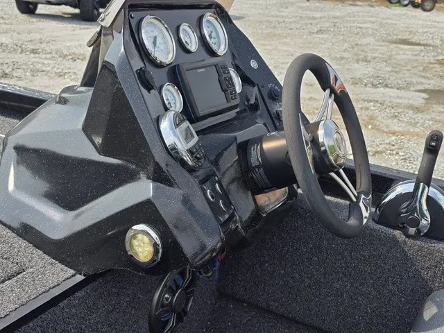 Slide: The Image of The image shows the dashboard of a 2020 Caravelle RAPTOR boat with multiple gauges and a steering wheel. - 17