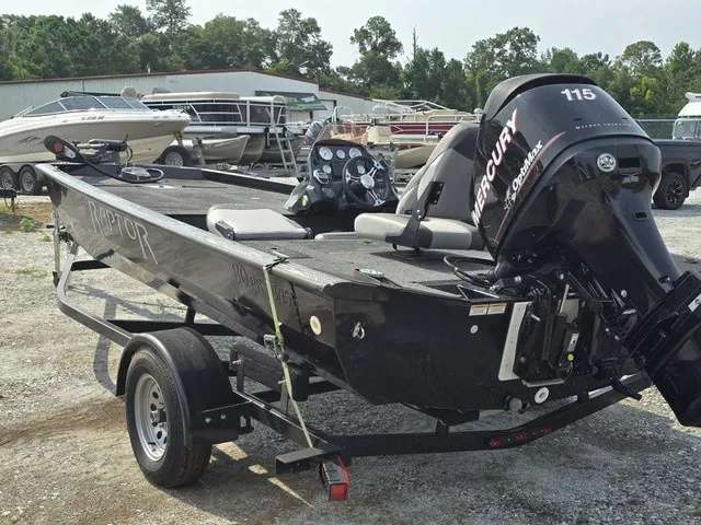 Slide: The Image of A black 2020 Caravelle RAPTOR boat on a trailer, featuring a Mercury 115 outboard motor. - 11
