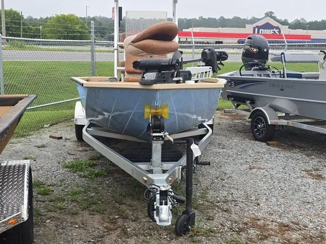Slide: The Image of A 2026 G3 Bay 19 GX boat sits on a trailer in a gravel lot. - 3