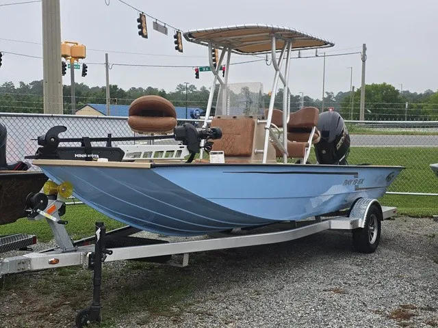 Slide: The Image of 2026 G3 Bay 19 GX in light blue with T-top and trailer. - 2