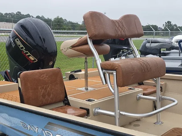 Slide: The Image of The image shows the cockpit of a G3 Bay 19 GX boat with brown seats and an outboard motor. - 27