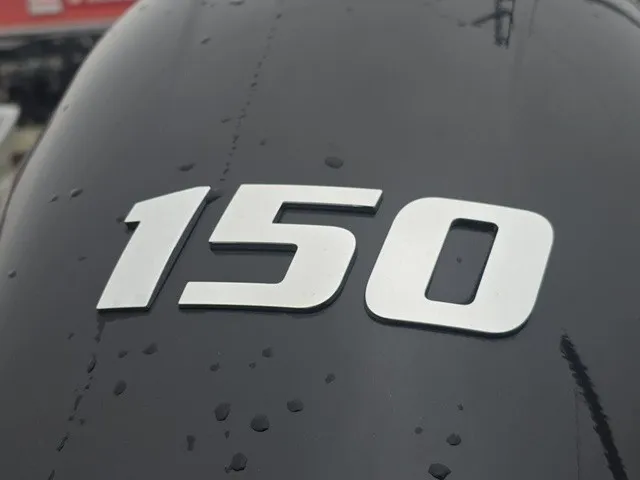 Slide: The Image of Close-up of an outboard motor with "150" marked on the cover. - 20