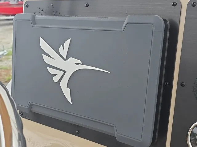 Slide: The Image of Close-up of a boat logo on a gray cover. - 24