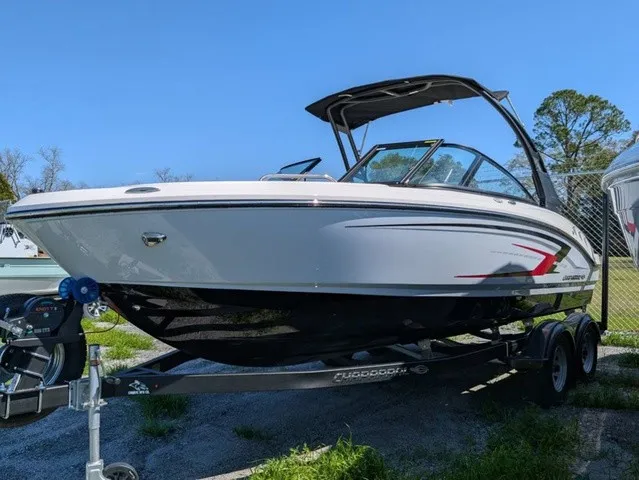 Slide: The Image of A white Chaparral 21 SSi boat from 2026 on a trailer, ready for use. - 2