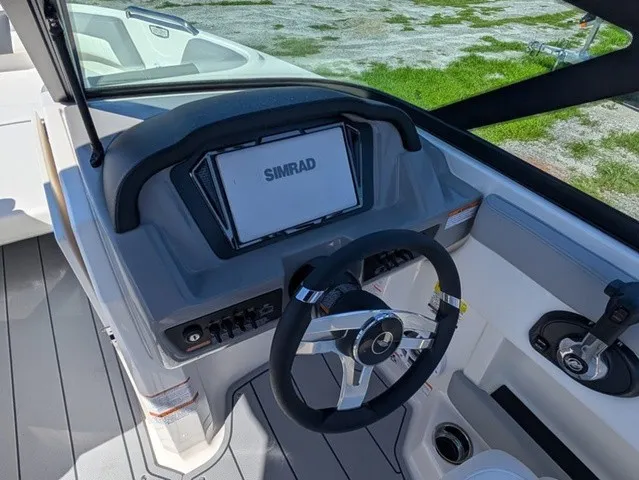 Slide: The Image of The image shows the cockpit of a Chaparral 21 SSi with a Simrad display and modern steering wheel. - 25