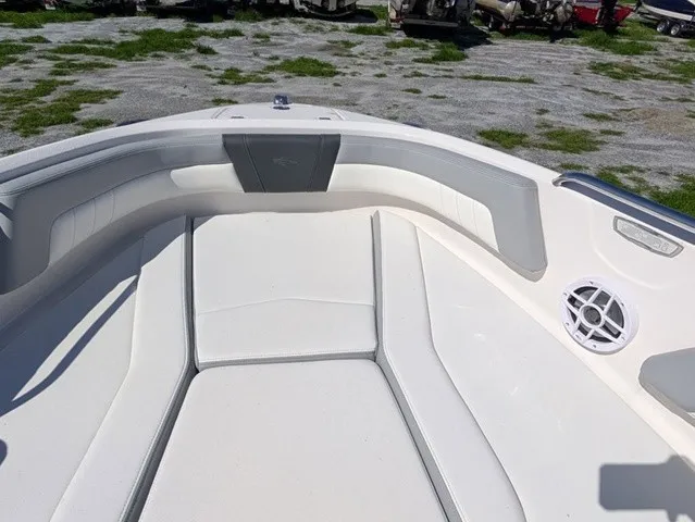 Slide: The Image of The image shows the bow area of a Chaparral 21 SSi boat with cushioned seating and a speaker. - 19