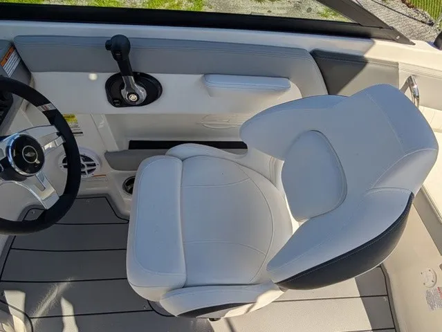 Slide: The Image of Interior of a 2026 Chaparral 21 SSi featuring a white cushioned seat and steering controls. - 28