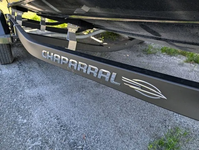 Slide: The Image of Close-up of a Chaparral 21 SSi boat trailer on a gravel path. - 6
