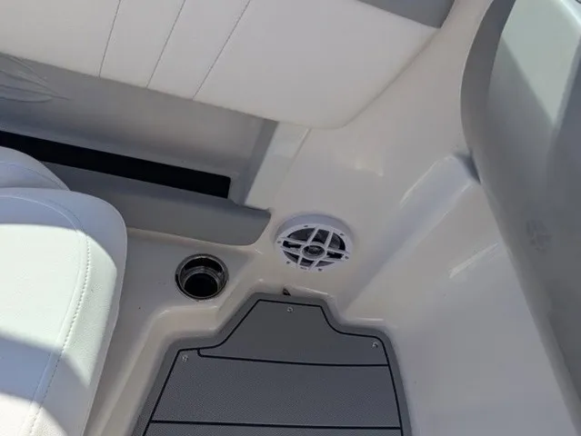 Slide: The Image of Interior of a Chaparral 21 SSi with gray flooring, white seating, and a speaker. - 22