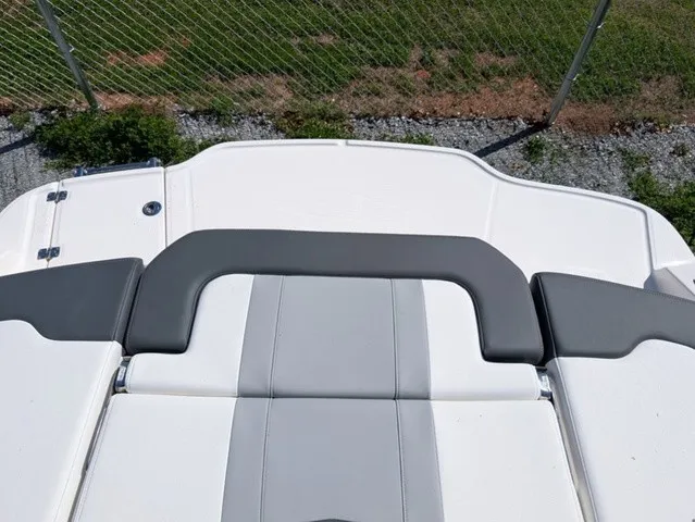 Slide: The Image of The image shows the stern of a Chaparral 21 SSi boat with gray and white upholstery. - 33