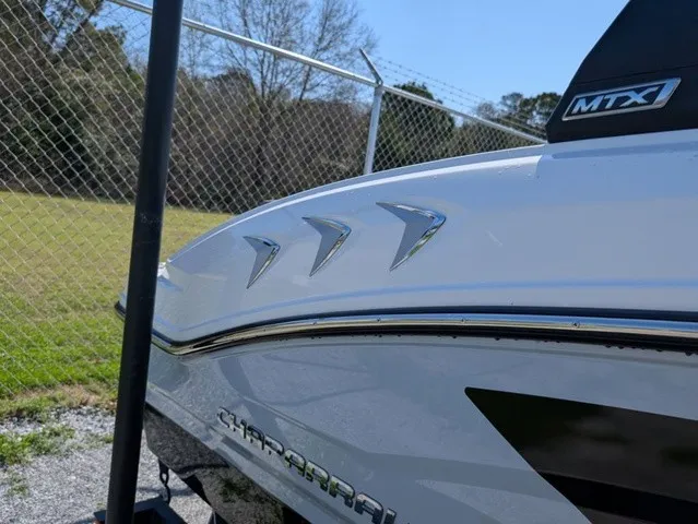 Slide: The Image of The image shows the rear of a 2026 Chaparral 21 SSi boat with sleek detailing. - 9
