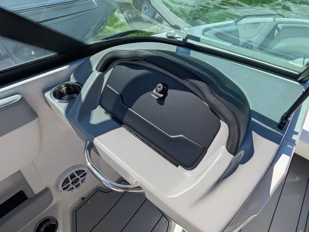 Slide: The Image of The image shows the dashboard of a Chaparral 21 SSi boat with a closed compartment. - 24