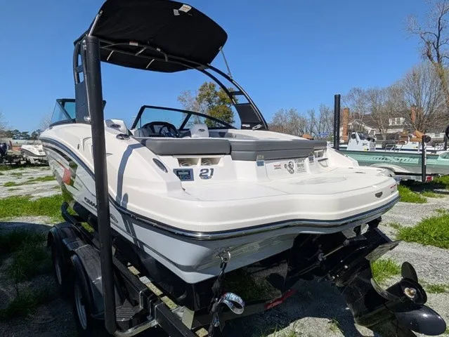 Slide: The Image of A white Chaparral 21 SSi boat from 2026 is on a trailer outdoors. - 10