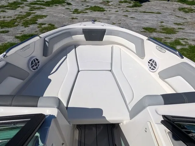 Slide: The Image of The image shows the bow area of a Chaparral 21 SSi boat with cushioned seating and speakers. - 16