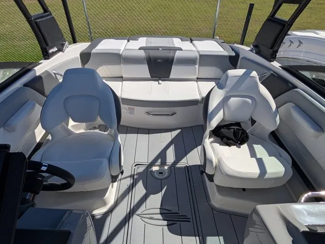Slide: The Image of The image shows the cockpit of a Chaparral 21 SSi boat with white seats and gray flooring. - 20