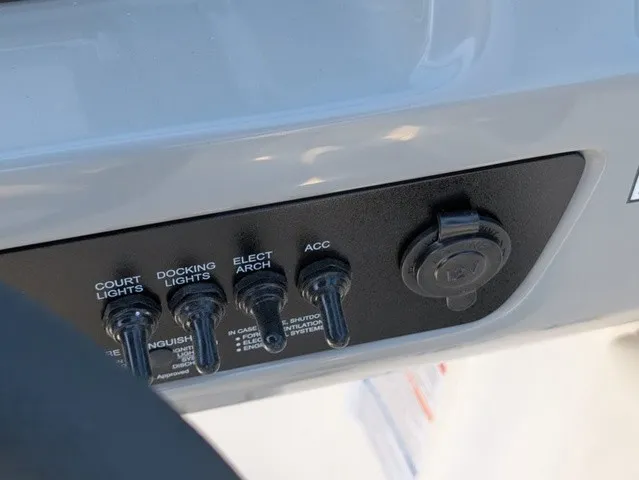 Slide: The Image of Close-up of a control panel with switches for lights and accessories. - 31