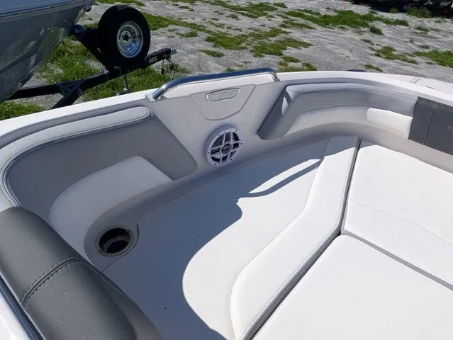 Slide: The Image of The image shows the bow area of a Chaparral 21 SSi boat with cushioned seating and a speaker. - 17
