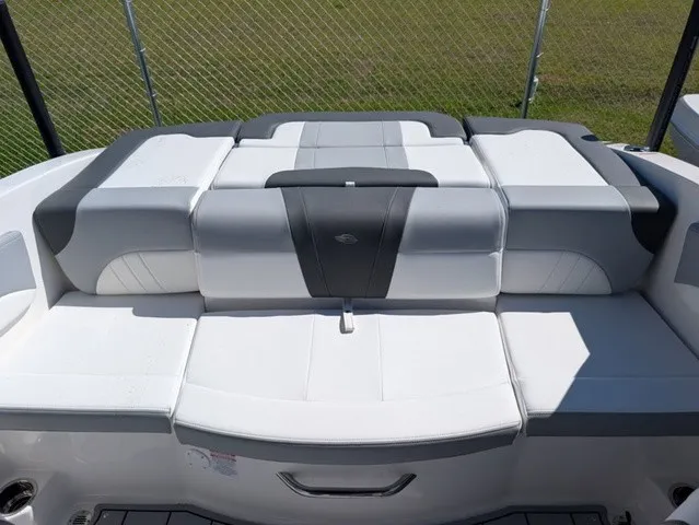 Slide: The Image of The image shows the padded aft deck of a 2026 Chaparral 21 SSi boat. - 32
