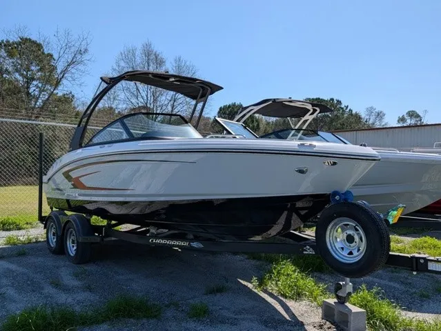 Slide: The Image of Chaparral 21 SSi 2026 on a trailer, featuring sleek design and Bimini top. - 3
