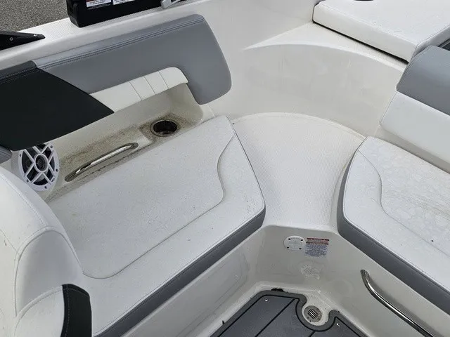 Slide: The Image of The image shows the seating area of a Chaparral 23 SSi boat with gray and white upholstery. - 14