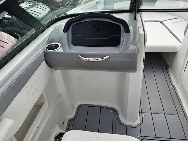 Slide: The Image of The image shows the cockpit of a Chaparral 23 SSi boat with gray and white accents. - 20