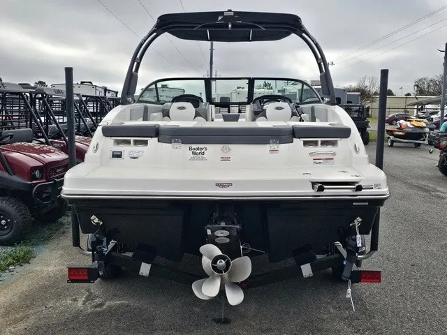 Slide: The Image of The image shows a 2026 Chaparral 23 SSi boat with a modern design and powerful engine. - 7