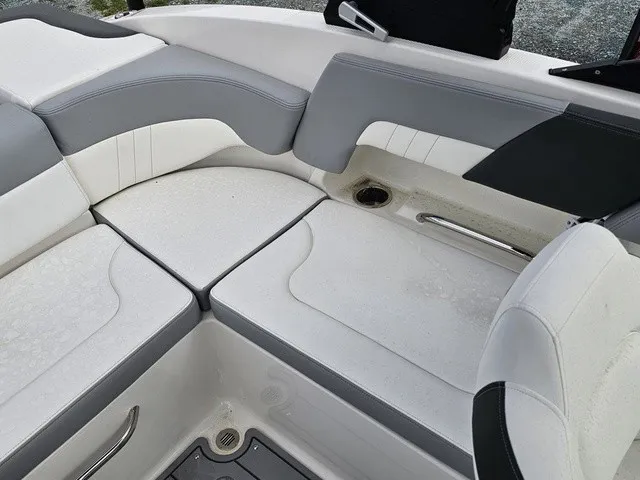 Slide: The Image of The seating area of a Chaparral 23 SSi boat with gray and white upholstery. - 15