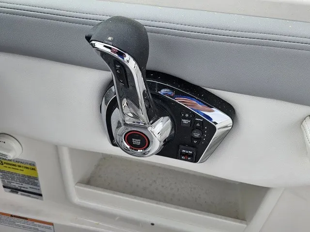 Slide: The Image of Close-up of a modern boat throttle with start button and controls. - 22