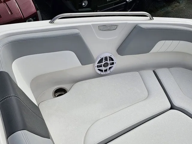 Slide: The Image of The image shows the bow area of a Chaparral 23 SSi boat with cushioned seating and a speaker. - 28