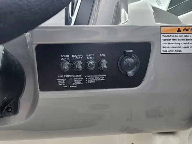 Slide: The Image of Dashboard of a Chaparral 23 SSi with switches for lights and accessories. - 26