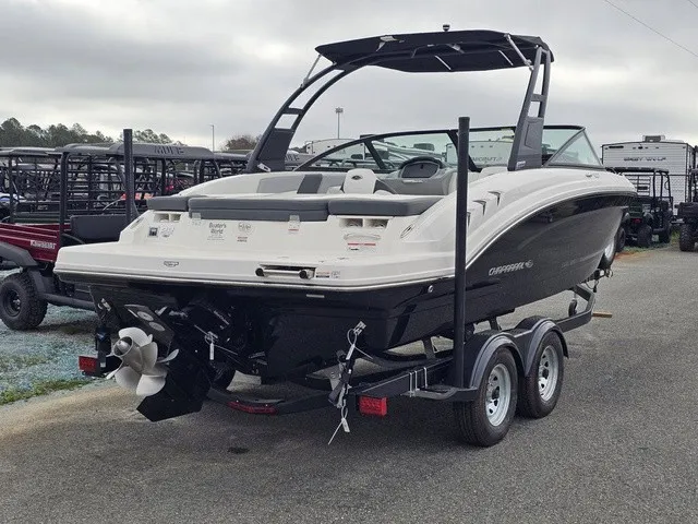 Slide: The Image of Chaparral 23 SSi 2026 on a trailer, featuring a black hull and modern design. - 6