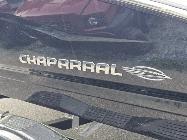 Slide: The Image of Close-up of Chaparral 23 SSi with shiny logo on black hull. - 9