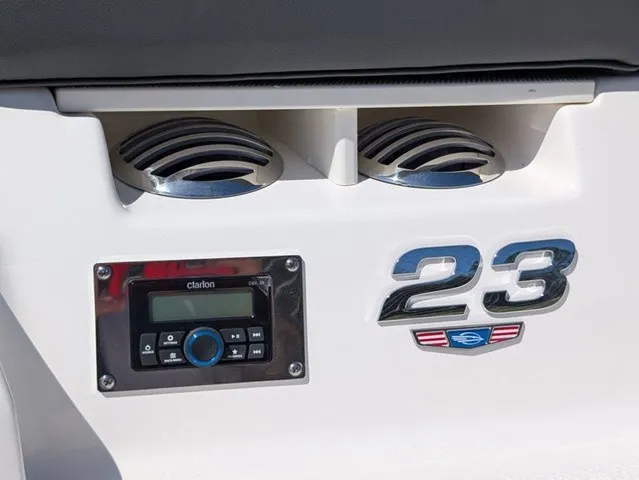 Slide: The Image of Close-up of a Chaparral 23 SSi featuring speakers and a Clarion audio system. - 12