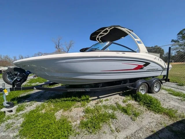 Slide: The Image of A 2026 Chaparral 23 SSi boat on a trailer. It features a sleek design and a Bimini top. - 9